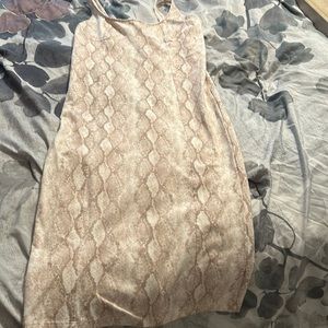 Snakeskin color body con dress mid length
